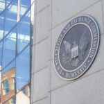SEC officials reviewing documents at a conference table with crypto rules framework papers spread across the surface