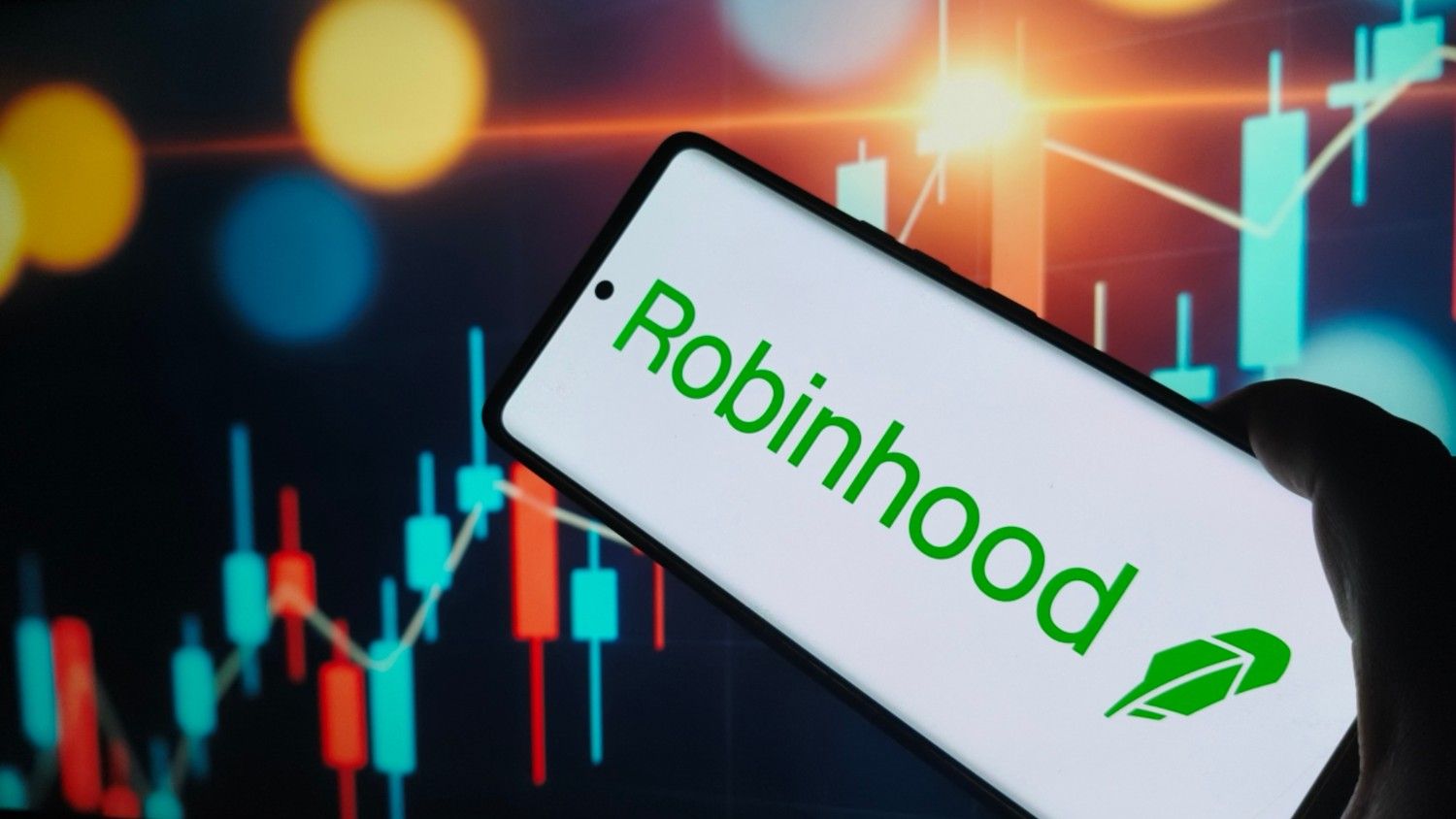 Robinhood's cryptocurrency trading platform interface displayed on a smartphone screen, showing UK crypto trading options and market data
