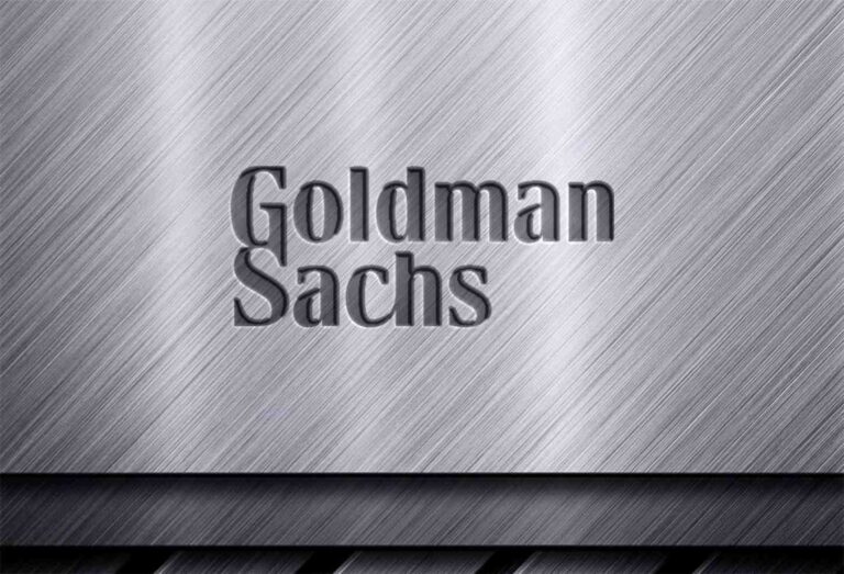Goldman Sachs trading floor with financial screens displaying cryptocurrency market data and ETF information