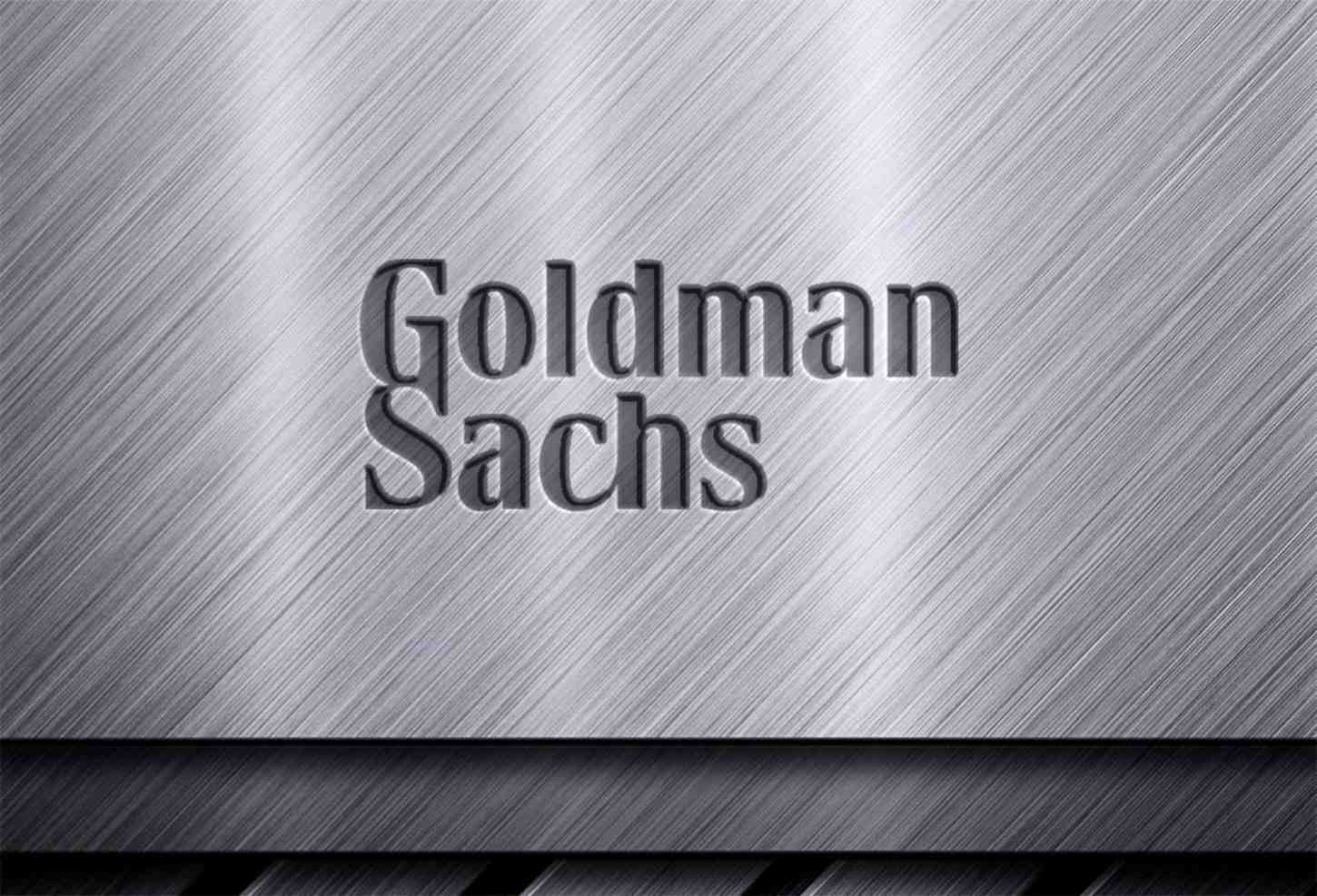 Goldman Sachs trading floor with financial screens displaying cryptocurrency market data and ETF information