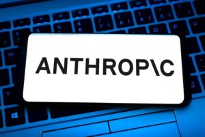 A financial analyst reviews an SEC filing for the short Anthropic ETF on a computer monitor in an