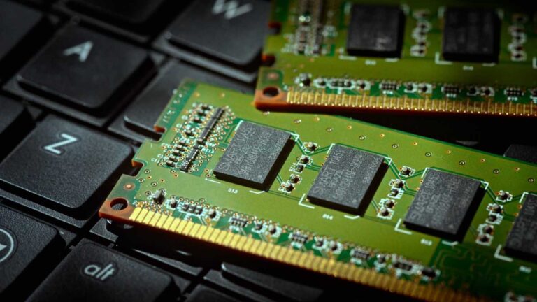 Close-up of DRAM memory modules on a circuit board, the component at the centre of the 2026 AI memory shortage